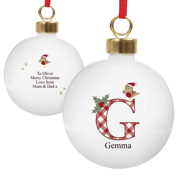 Two Christmas ornaments with personalized messages on a white background