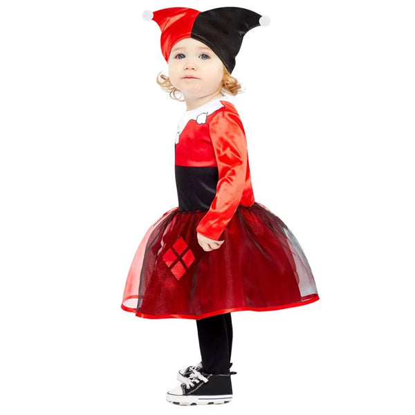 Child wearing a red, black, and white Harley Quinn costume with a tutu skirt on a white background