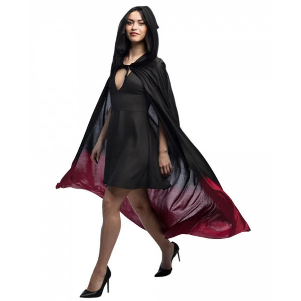 Woman wearing a black and red cape on a white background