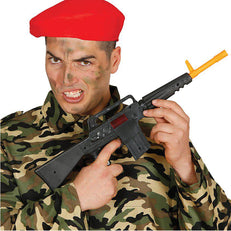 A Man Holding A Machine Gun