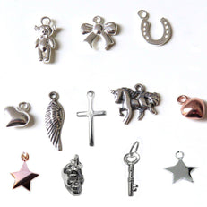 Charms include : hearts,teddy bear,stars,unicorn,cross,horseshoe,angel wing,bow,skull,key