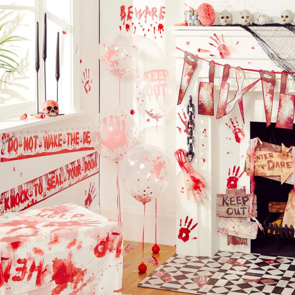 Horror-themed room decor with blood splatters, warning signs, and balloons.