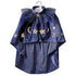 Blue cape with star and moon patterns on a white background