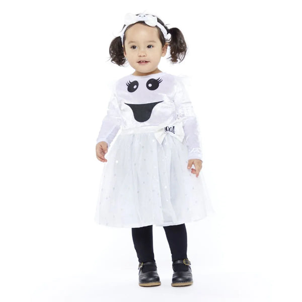 Child wearing a ghost costume with a white background