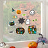 Halloween-themed window stickers on a glass pane with pumpkins and decorations.