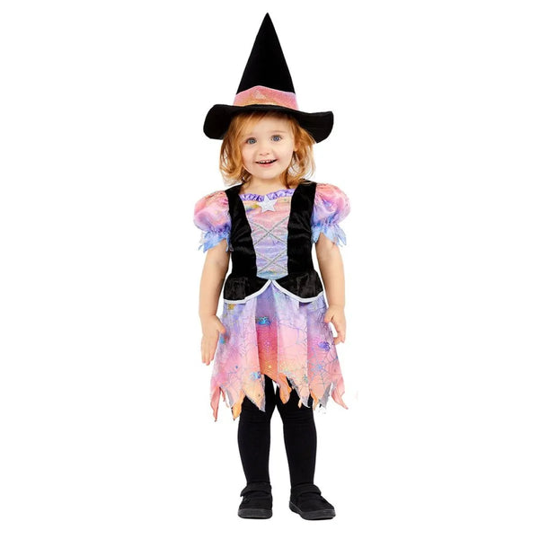 Child wearing a colorful witch costume with a black hat on a white background