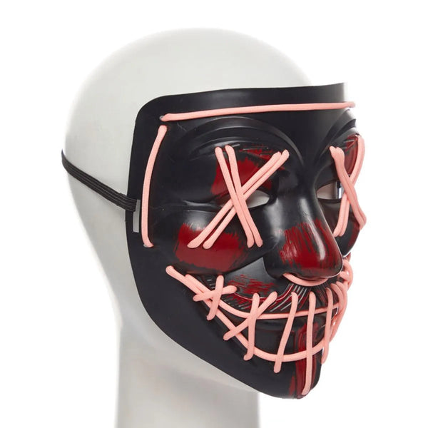 Black mask with pink accents on a mannequin head against a white background