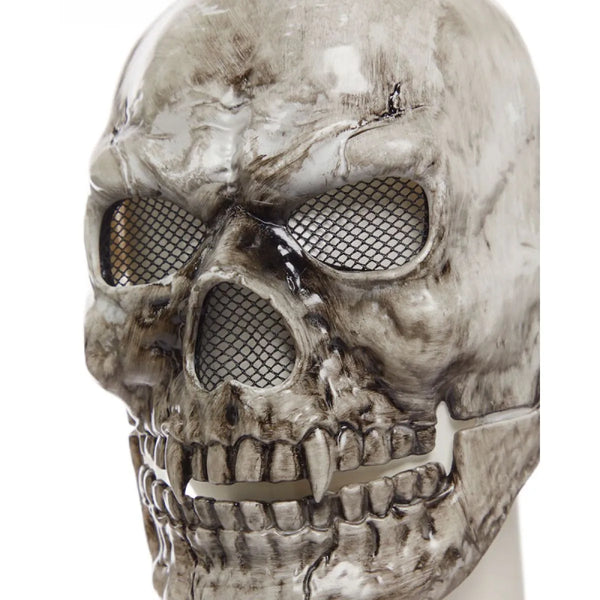 Skull-shaped mask with mesh eyes and teeth on a white background