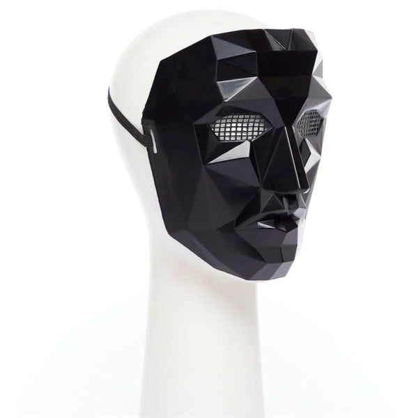 Black Squid Game Front Man mask on a white mannequin head against a white background