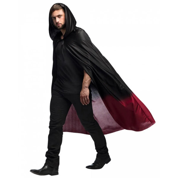 Man wearing a black cape with a red lining on a white background