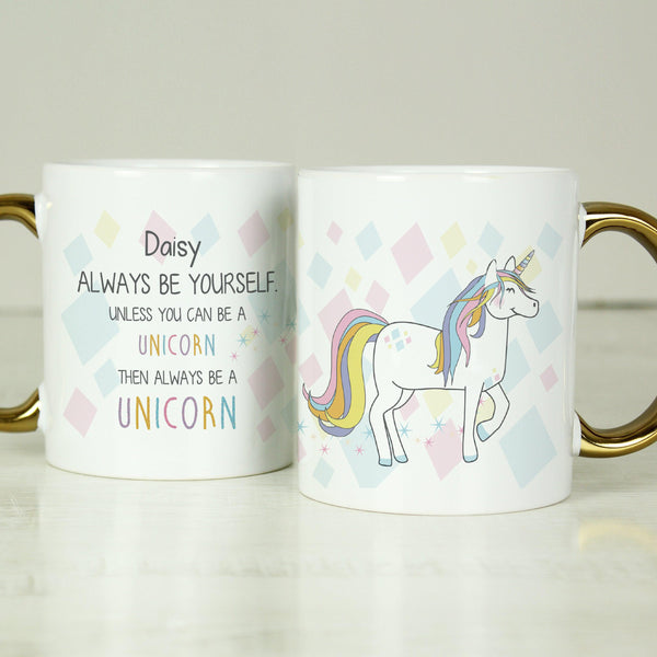 White Unicorn mug with a gold colour handle and colourful Unicorn
