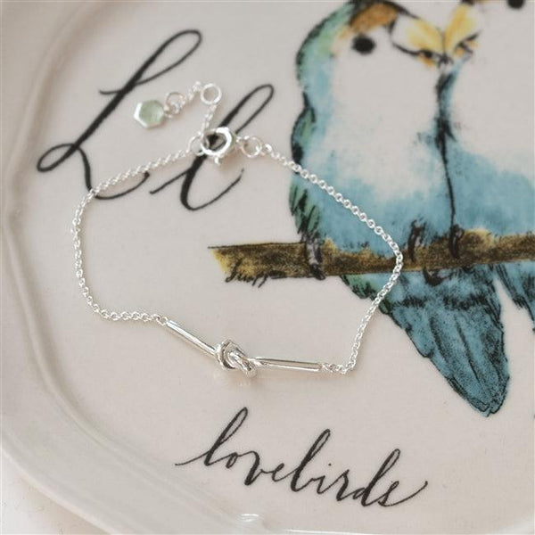 Friendship Knot Sterling Silver Bracelet Showcased On A Lovebird Plate