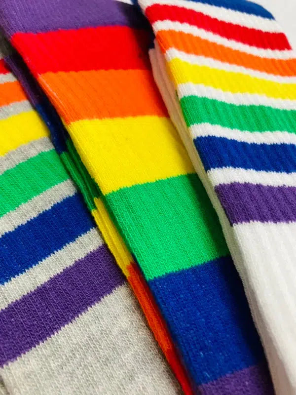 Close up of 3 pairs of rainbow socks