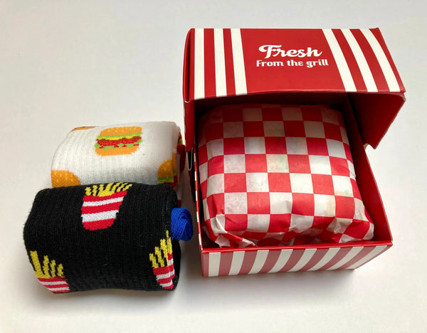 Socks wrapped in diner paper inside burger box packaging