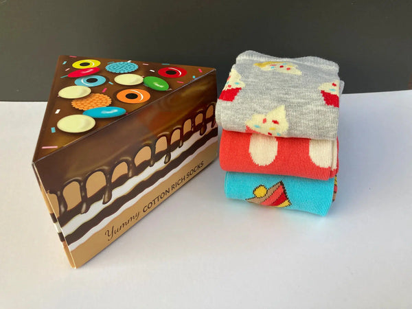 Cake Box with Three Pairs of Folded Socks