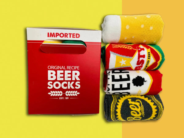 Side aerial view of beer box and 4 different style beer themed socks