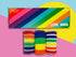 Colourful themed rainbow socks packaged in prism rainbow box
