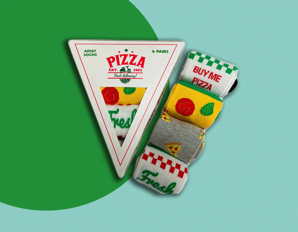 Pizza themed socks rolled up next to pizza slice sock packaging