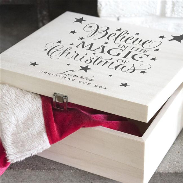 A Beautiful Wooden Believe Christmas Eve Box With Text That Reads "Believe In The Magic Of Christmas" Engulfed In Stars