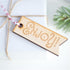 Decorative, wooden cut out tags engraved with Enjoy!. Supplied hanging from red & white baker's twine (10pk)