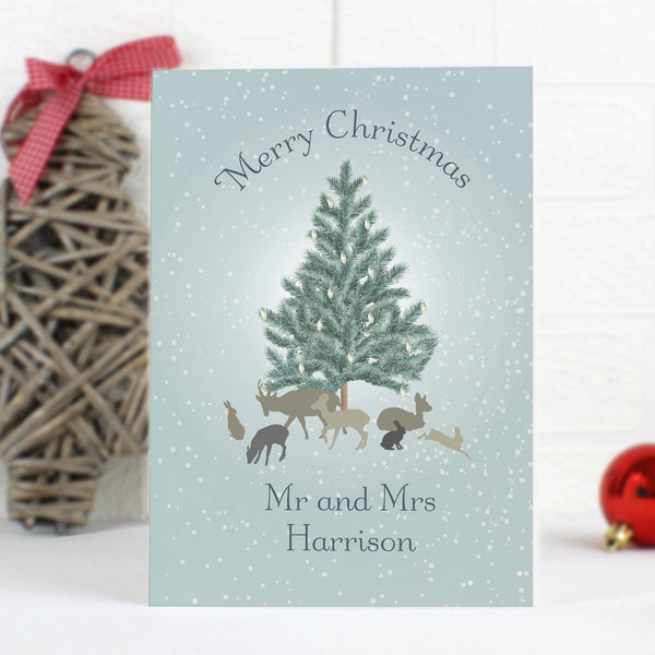 Personalised A Winter's Night Card - Front Of The Card Depicts A snowy Scene With Woodland Animals Around A Tree 