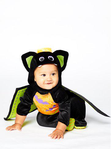 Baby Dressed in A Iddy Biddy Bat Onesie Whilst Crawling