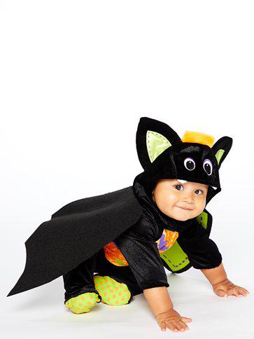Baby Dressed in A Iddy Biddy Bat Onesie About to Take Flight