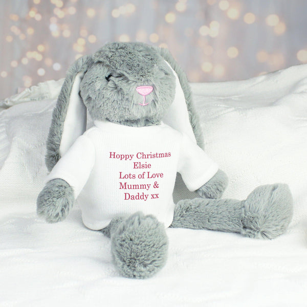 Grey fluffy bunny sitting down with text that reads 