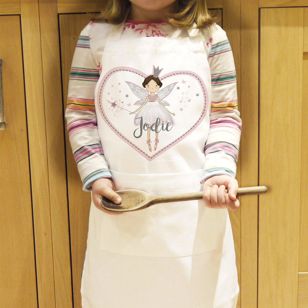 Personalised Fairy Princess Children's Apron - Modelled By A Young Child Who I Ready To Bake