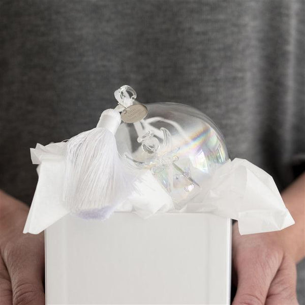 Packaged in a white bauble box wrapped in tissue and packaged safely and securely with bubble-wrap in a sturdy box.