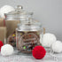 A sturdy glass Christmas jar with rubber seal on the push on lid, personalise text inside a festive wreath designythinguneed