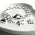 Personalised Initial Charm Link Bracelet Set Out With The Initial K And Silver Heart, Silver Star And Silver Butterfly