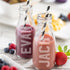 Personalised Mini Juice Bottle - Two Personalised Juice Bottles Sat Outside On A Hot Summers Day