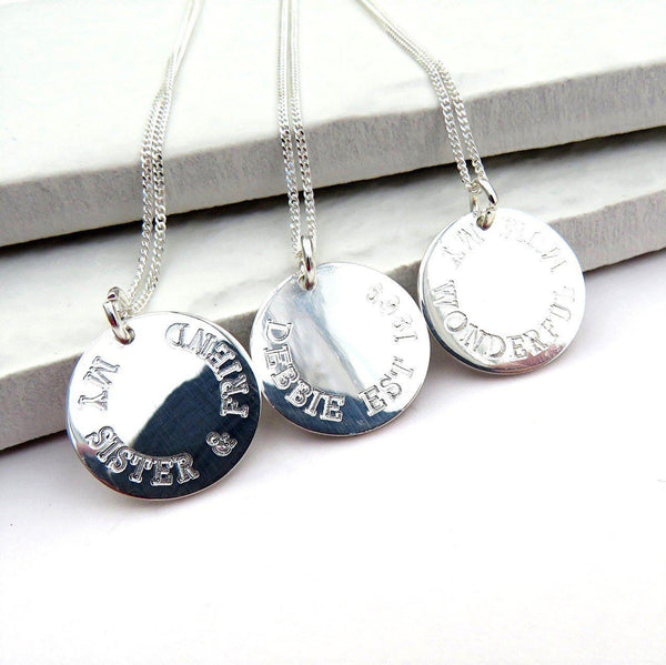 Personalised Sterling Silver Round Charm Necklaces Which Are All Engraved With A Special Message
