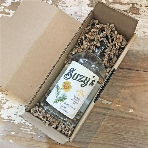 Spiced rum packing with shredded cardboard