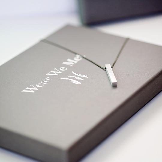 Picture of the brushed necklace on a beautiful gift box
